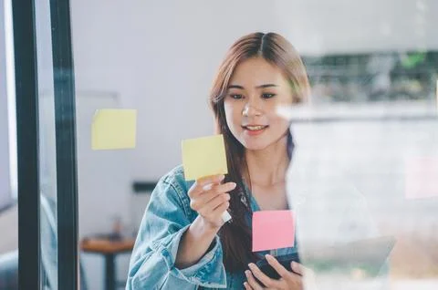 Web designers creating planning and analyzing with Colorful sticky notes on.. Stock Photos