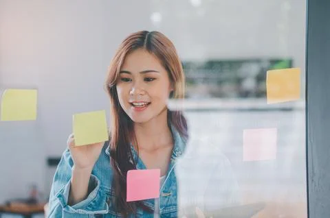 Web designers creating planning and analyzing with Colorful sticky notes on.. Stock Photos