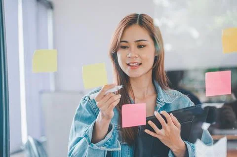 Web designers creating planning and analyzing with Colorful sticky notes on.. Stock Photos