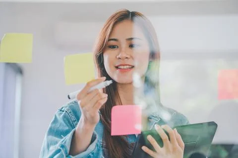 Web designers creating planning and analyzing with Colorful sticky notes on.. Stock Photos