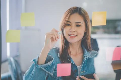 Web designers creating planning and analyzing with Colorful sticky notes on.. Stock Photos
