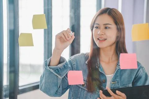 Web designers creating planning and analyzing with Colorful sticky notes on.. Stock Photos