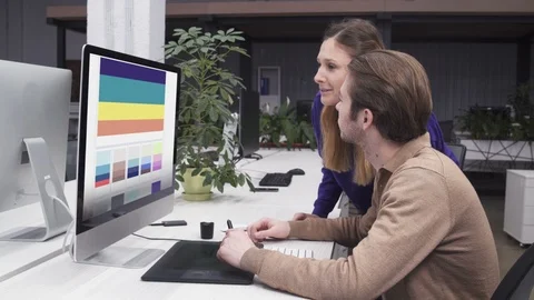 Web Designers Working Together and Creating Color Schemes Palettes Stock Footage 106067955