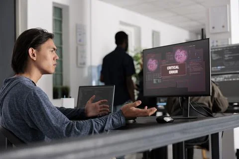 Web developer doing i don t know gesture while having web server hacked Stock Photos