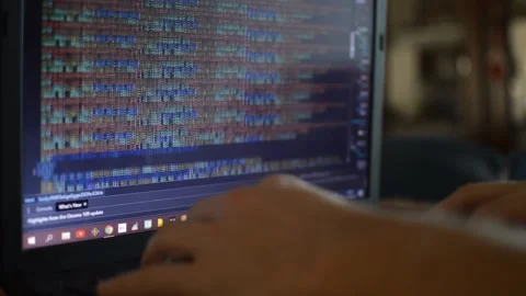 Web developer on laptop write a code program for software. Stock Footage 233684303