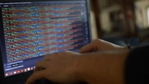 Web developer on laptop write a code program for software. Stock Footage 233684532