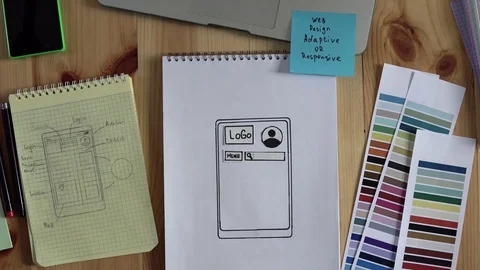 The web developer makes the layout of the website on his notebook. Stock Footage 83202499