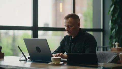 Web Developer Or Business Analyst Working Remotely, Smart Man With Few Gadgets Vídeo Stock 243311197