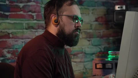 Web Developer of Programmer From 1980's Working on Computer Listening Music Stock Footage 305571088