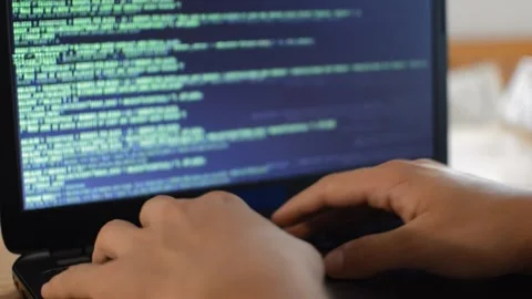 Web developer programming a software on his laptop. web laptop coding. Stock Footage 211634815