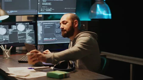 Web developer taking supplements out of box in office Stock Footage 229333278