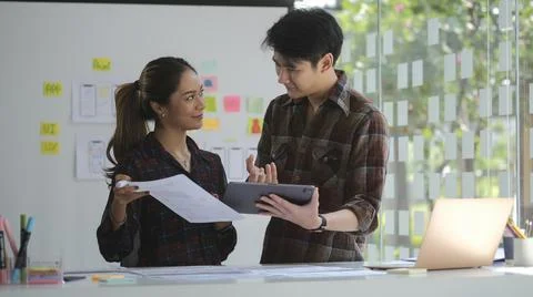 Web developer team are working about planning mobile application project toge Stock Photos