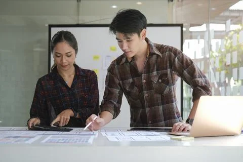 Web developer team are working about planning mobile application project toge Stock Photos