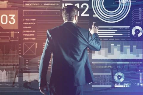 Web developer touching the screen while working with a futuristic device 库存照片