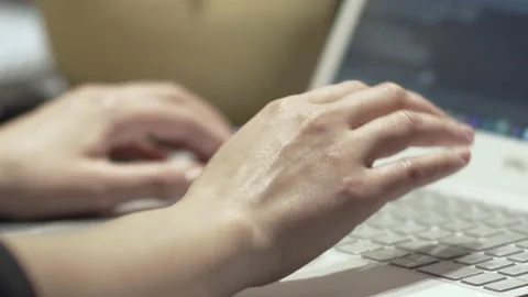Web developer at work. Woman's hands typing and coding software on the laptop Stock Footage 231649189