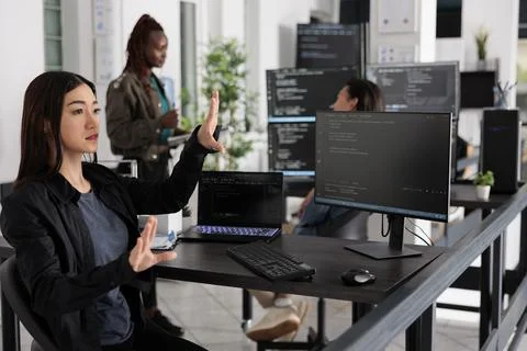 Web developer working with hologram and coding language Stock Photos