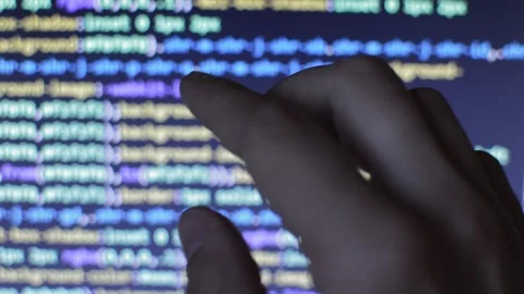 Web developer's hand on a code program blur background. sotware code. Stock Footage 245479809
