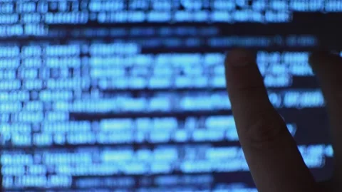 Web developer's hand monitoring code program for software Stock Footage 199019786