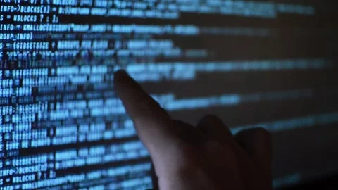 Web developer's hand monitoring code program for software Stock Footage 199019939