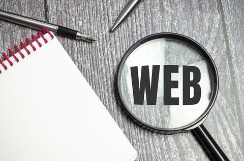 Web development concept Web word on magnifier. Development Stock Photos