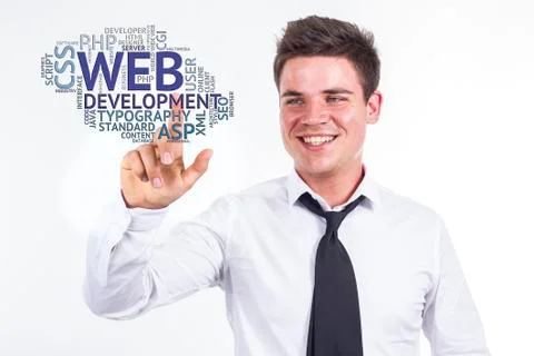 Web development - Young businessman touching word cloud Stock Photos