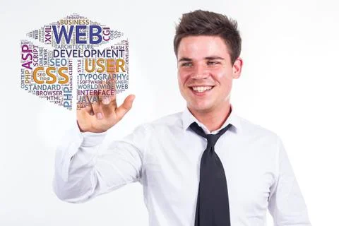Web development - Young businessman touching word cloud Stock Photos