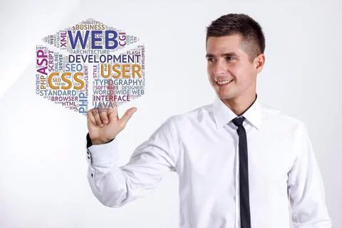 Web development - Young businessman touching word cloud Stock Photos
