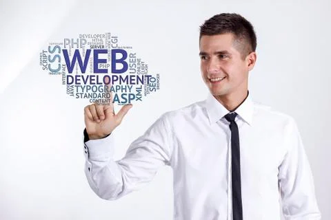 Web development - Young businessman touching word cloud Stock Photos