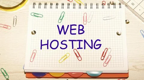 Web Hosting text on a notebook in a cage with scattered paper clips on a note Stock Photos