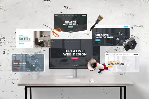 Web pages flying around a web designer's desk and computer display featuring Stock Photos