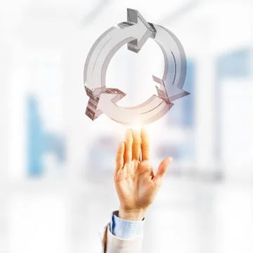 Web refresh icon and male hands as symbol for internet use. Mixed media Stock Photos