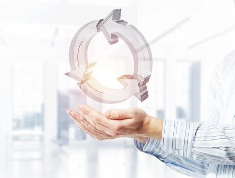 Web refresh icon in male hands as symbol for internet use. Mixed Stock Photos