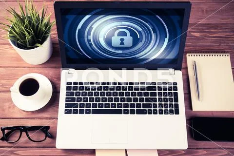 Web security and technology concept with laptop on wooden table Stock Photos