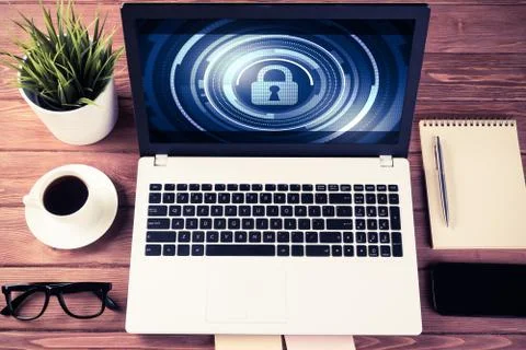 Web security and technology concept with laptop on wooden table Stock Photos