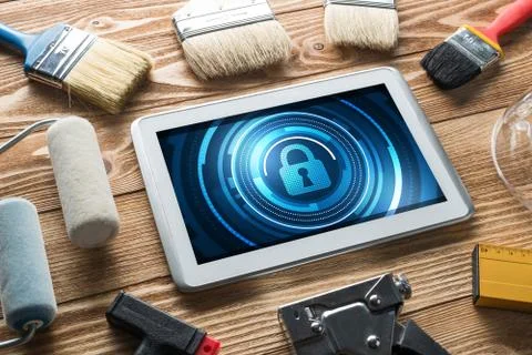 Web security and technology concept with tablet pc on wooden table Stock Photos