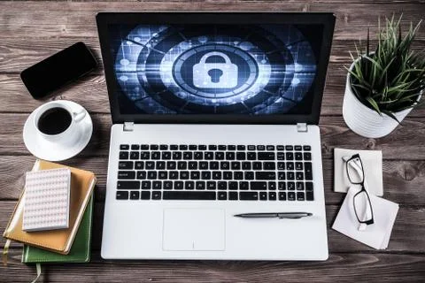 Web security and technology concept with laptop on wooden table Stock Photos