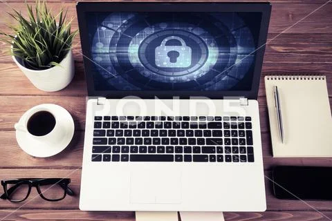 Web security and technology concept with laptop on wooden table Stock Photos