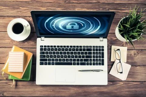Web security and technology concept with laptop on wooden table Stock Photos