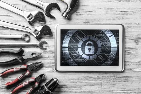 Web security and technology concept with tablet pc on wooden table Stock Photos