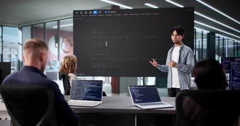 Web Software Developers Meet In Classroom For Late Night Meeting Stock Photos