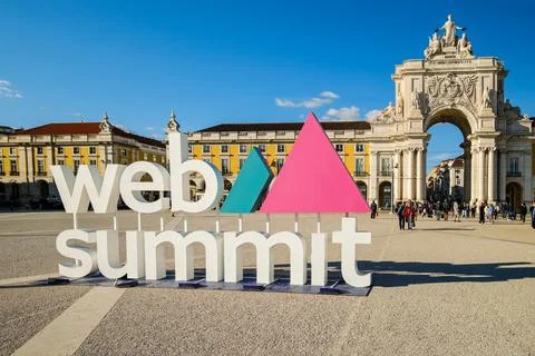 Web Summit signage at Commerce square, Lisbon, Portugal on sunny day, clear blue Stock Photos