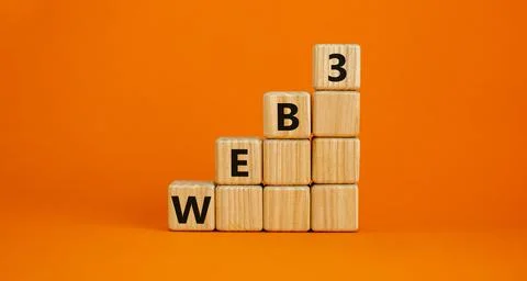 WEB3 or web 3 symbol. Wooden cubes with concept words WEB 3. Beautiful orange Stockfoto's