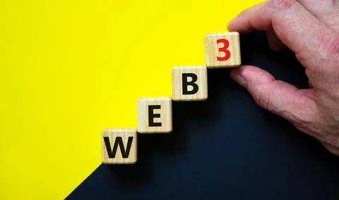 WEB3 or web 3 symbol. Wooden cubes with concept words WEB 3. Beautiful yellow Stockfoto's