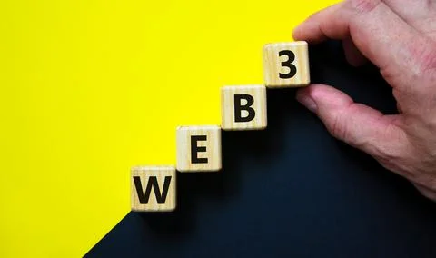 WEB3 or web 3 symbol. Wooden cubes with concept words WEB 3. Beautiful yellow Stockfoto's