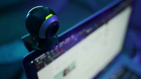 Webcam on computer screen or laptop records video while person working on it Stock Footage 163703567