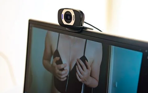 Webcam model working live in front of camera. Fotos de archivo