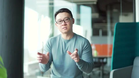 Webcam view. Asian Male Freelancer. Portrait young smiling employee support  Stock Footage 166232855