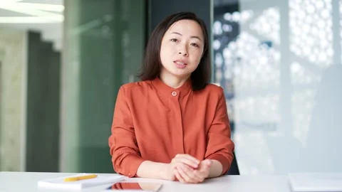 Webcam view. Confident Asian businesswom... | Stock Video