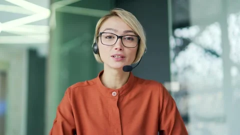 Webcam view. A corporate operator who works in the support service speaks  Stock Footage 239024429