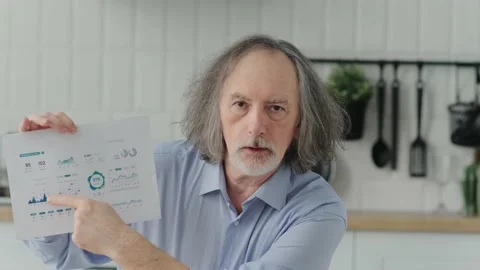 Webcam View with a elderly middle-aged man works at home remotely showing a Stock Footage 239836824